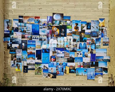 Collage of photos hanging on a wall. Stock Photo