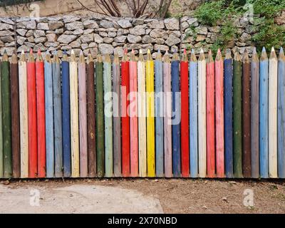 Wall made with giant wooden pencils. Stock Photo