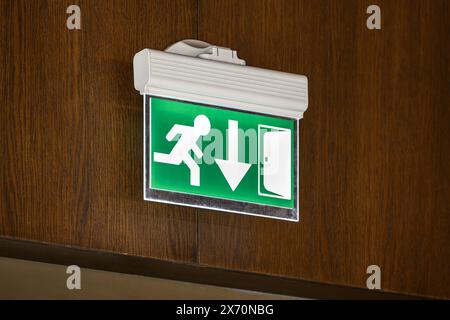 modern emergency exit sign showing emergency exit downwards Stock Photo