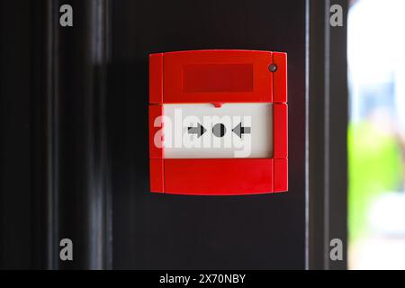 Full front view of outdoor wall mounted fire alarm button Stock Photo