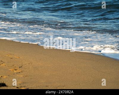 Beautiful curved water waves are used as a background image. Ocean wave. Spectacular aerial top background photo of white wave of ocean sea water spla Stock Photo