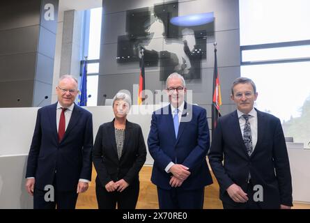 Hanover, Germany. 17th May, 2024. Stephan Weil (SPD, l-r), Minister President of Lower Saxony, Hanna Naber (SPD), President of the State Parliament of Lower Saxony, Andreas Busch, Professor of Political Science at the University of Göttingen, and Wilhelm Mestwerdt, President of the State Court of Lower Saxony, stand at a ceremony to mark 75 years of the Basic Law in the State Parliament of Lower Saxony. Credit: Julian Stratenschulte/dpa/Alamy Live News Stock Photo