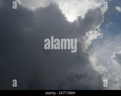 Cumulonimbus cloud formations on tropical sky , Nimbus moving , Abstract background from natural phenomenon and gray clouds hunk , Thailand Stock Photo