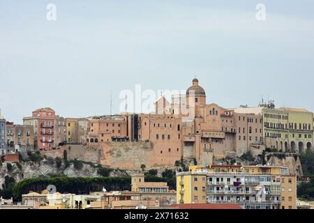 View of Cagliari, Sardinia, Italy with Medieval fortified and walled Quartiere Castello, on hill in background Stock Photo