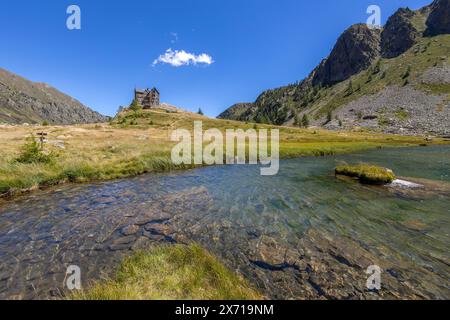 View of Guglielmo Migliorero Refuge and the lower lake of the Ischiator in the Maritime Alps in the municipality of Vinadio, in the province of Cuneo, Stock Photo