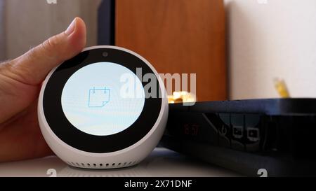 Paris, France - Jun 5th, 2020: The Amazon Echo Spot displays a calendar icon on its screen, indicating access to scheduling features Stock Photo