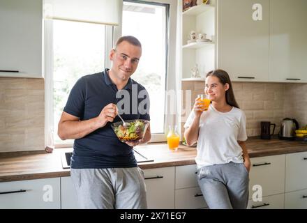 A married couple is having breakfast together in the kitchen Stock Photo