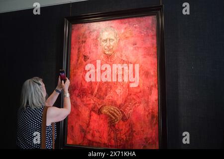 London, UK. 17 May, 2024.  The official painting of King Charles III since his coronation painted by Jonathan Yeo (b.1970) on exhibition at the Philip Mould company.   The painting was commissioned by The Draper's Company and  was unveiled  at  a ceremony at Buckingham Palace on  15 May.The King is portrayed in the uniform of Colonel of the Welsh Guards and the monarch butterfly - the King’s idea - refers to his environmental concerns and interests Credit: amer ghazzal/Alamy Live News Stock Photo