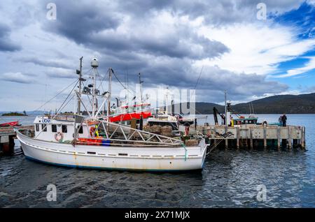 Fishing boats tied up at Dover public jetty, Dover Tasmania Stock Photo