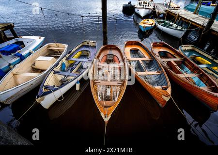 Rowboats and pleasure craft tied up on banks of Huon River, Franklin Tasmania Stock Photo