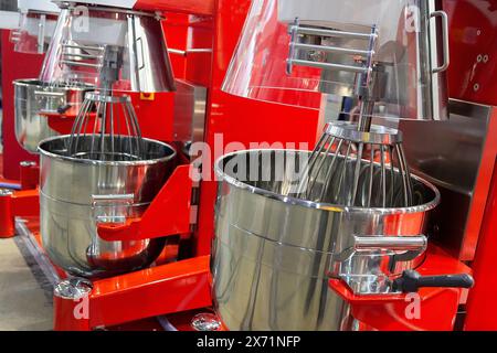 Modern industrial mixers at the stand in the exhibition hall. Food industry Stock Photo