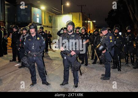 Police officers with full gear gather on the streets near the UC ...