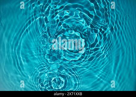 Rippling Water Surface with Circular Waves Stock Photo