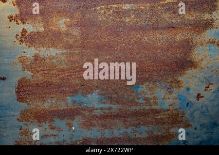 Rust on a metal blue panel for a grunge background and texture Stock Photo