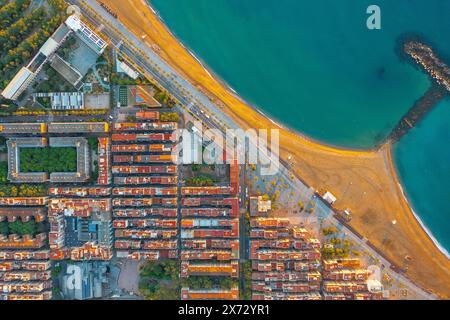 View of residential buildings on the oceanfront in Barcelona Spain. Sea spit in blue water. Housing on the seashore Stock Photo