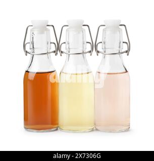 Different types of vinegar in bottles isolated on white Stock Photo