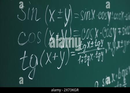 Many different math formulas written on chalkboard Stock Photo