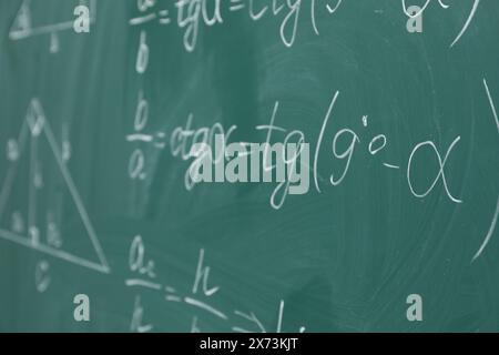 Many different math formulas written on chalkboard Stock Photo