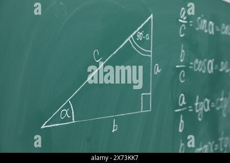 Many different math formulas written on chalkboard Stock Photo