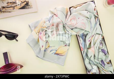 Beautiful floral silk headscarf (Hijab) for Muslim women. High-quality chiffon fabric with elegant design that creates a stunning classy look. Stock Photo