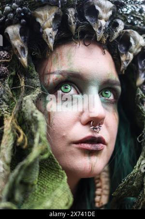 Leipzig, Germany. 17th May, 2024. A druidess visits the 'Victorian Picnic' at the 31st Wave-Gotik-Treffen. Several thousand fans of the 'black scene' gathered in Leipzig on Friday for the start of the 31st Wave-Gotik-Treffen (WGT). There are more than 40 venues for the WGT fans, including churches and cemeteries. The meeting started in 1992 with just 2000 like-minded people and eight bands. According to the organizers, the WGT is now considered one of the largest gatherings of its kind and has fans all over the world. Credit: Jan Woitas/dpa/Alamy Live News Stock Photo