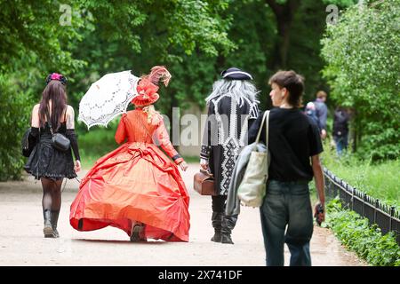 Leipzig, Germany. 17th May, 2024. Visitors to the 31st Wave-Gotik-Treffen walk through Johannapark. Several thousand fans of the 'black scene' gathered in Leipzig on Friday for the start of the 31st Wave-Gotik-Treffen (WGT). There are more than 40 venues for the WGT fans, including churches and cemeteries. The meeting started in 1992 with just 2000 like-minded people and eight bands. According to the organizers, the WGT is now considered one of the largest gatherings of its kind and has fans all over the world. Credit: Jan Woitas/dpa/Alamy Live News Stock Photo