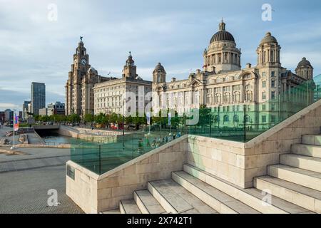 The Three Graces seen from the steps of the Museum of Liverpool, Liverpool waterfront, England. Stock Photo