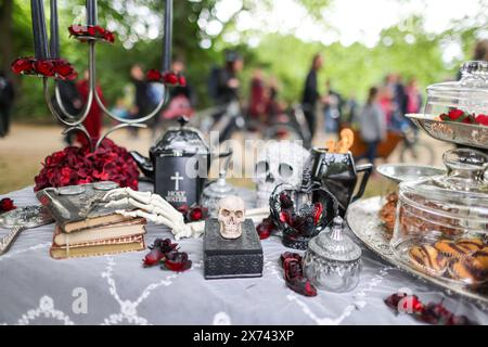 Leipzig, Germany. 17th May, 2024. A richly laid table for the 'Victorian Picnic' at the 31st Wave-Gotik-Treffen. Several thousand fans of the 'black scene' gathered in Leipzig on Friday for the start of the 31st Wave-Gotik-Treffen (WGT). There are more than 40 venues for the WGT fans, including churches and cemeteries. The meeting started in 1992 with just 2000 like-minded people and eight bands. According to the organizers, the WGT is now considered one of the largest gatherings of its kind and has fans all over the world. Credit: Jan Woitas/dpa/Alamy Live News Stock Photo