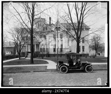 Three-story house with side porch and automobile in front, possibly Detroit, Michigan, Title devised by cataloger., 'G 5736' on negative., Detroit Publishing Co. no. X 332., Gift; State Historical Society of Colorado; 1949,  Dwellings. , Automobiles. Stock Photo