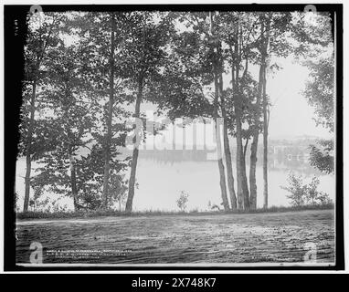 A glimpse of Mirror Lake, Adirondack Mountains, 'WHJ 910' on negative., Detroit Publishing Co. no. 014819., Gift; State Historical Society of Colorado; 1949,  Lakes & ponds. , United States, New York (State), Adirondack Mountains. , United States, New York (State), Mirror Lake. Stock Photo