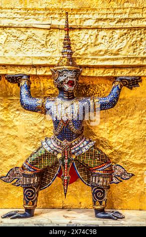 Detail of one of the supporting Thai monkey sculpture at a golden chedi at Wat Phra Kaew in Bangkok, Thailand Stock Photo