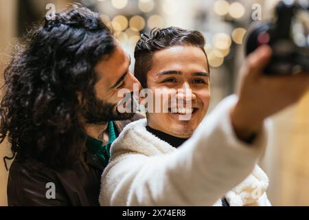 Two men taking a picture of each other Stock Photo
