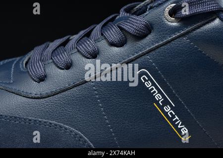 Camel Active blue leather men's shoes close up detail logo on black Stock Photo