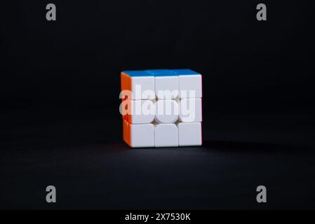 Salvador, Bahia, Brazil - May 15, 2024: Classic 3x3x3 Rubiks Cube on a black background. Rubiks Cube invented by Hungarian architect Erno Rubik in 197 Stock Photo