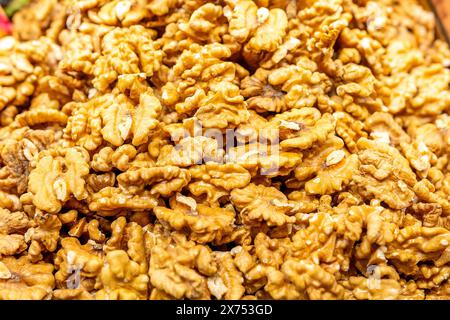 Heap of fresh raw brown crispy walnuts arranged on surface. Stock Photo