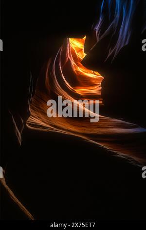 Light filters down in beautiful colors through the naturally sculpted sandstone slot canyon known as Upper Antelope Canyon near Page, Arizona. (USA) Stock Photo
