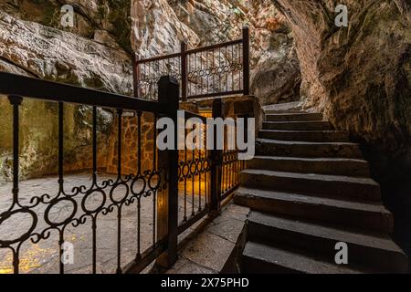 People visiting the sacred place, Eshab-i Kehf Cave ( Seven Sleepers Cave). The Seven Sleepers Ruins or Ashab-ı Kehf Cave located at Tarsus, Turkey, i Stock Photo