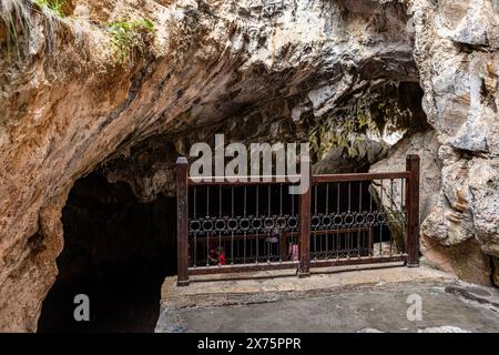 People visiting the sacred place, Eshab-i Kehf Cave ( Seven Sleepers Cave). The Seven Sleepers Ruins or Ashab-ı Kehf Cave located at Tarsus, Turkey, i Stock Photo