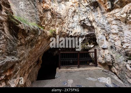 People visiting the sacred place, Eshab-i Kehf Cave ( Seven Sleepers Cave). The Seven Sleepers Ruins or Ashab-ı Kehf Cave located at Tarsus, Turkey, i Stock Photo