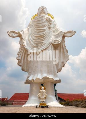 A large statue of a standing Buddha in a Buddhist temple Wat Bang Ping, Bang Mueang, Thailand Stock Photo