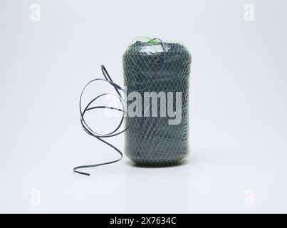 green plastic rope roll isolated on white background Stock Photo