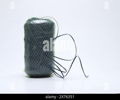 green plastic rope roll isolated on white background Stock Photo