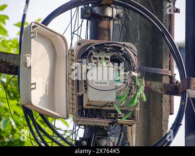 Jakarta, Indonesia - may 06, 2024 : internet fiber optic box broken open Stock Photo