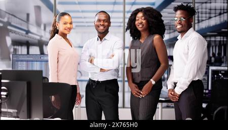 Happy Group Of Business People Standing In Office Stock Photo