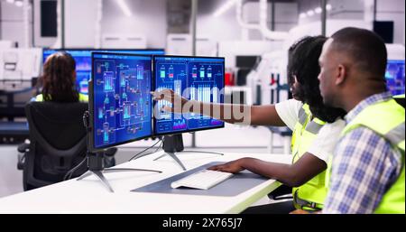 Engineer Operators Using Scada System At Industrial Plant Stock Photo