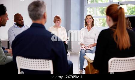 Multiethnic People Reading Bible In Group Circle Stock Photo