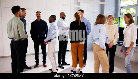 Business Communication In Office And Teamwork. Standing Meeting Stock Photo
