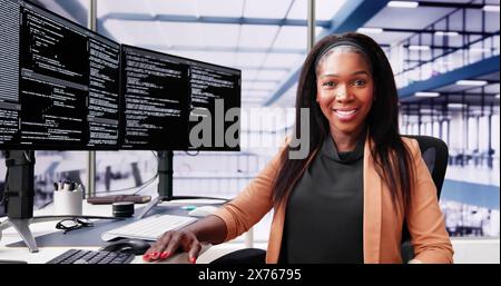 African American Coder Using Computer At Desk. Web Developer Stock Photo