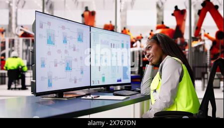 Tired Unhappy Woman In Automotive Car Factory Using Scada System Stock Photo