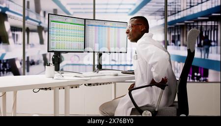 Medical Doctor With Back Pain. Bad Posture Stock Photo